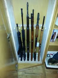 * this rack is 24 wide and protrudes 3 1/4 from wall, while accommodating 4 barrels per foot in 2 1/4 openings. Gun Cabinet Plans