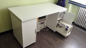A sewing machine desk has a flat table top. Sewing Machine Table With Smart Sliding Tray For Machine Ikea Hackers