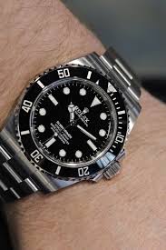 The rolex submariner is a pretty darn good answer. The Rolex Submariner Ref 124060