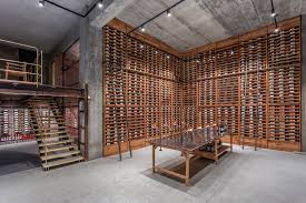Large traditional style wine room with ceiling detail: Gallery Of Vineria Wine Cellar Ns Studio 1