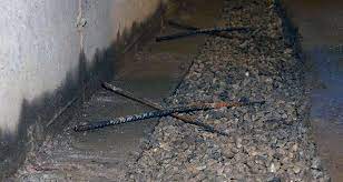 Rising water can find its way through cracks. Fixing A Concrete Basement Floor American Dry