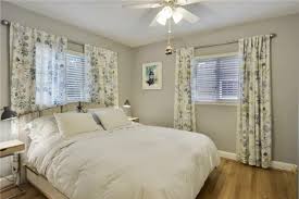 Balancing An Off Center Window Behind Bed With Curtains Window Behind Bed Off Center Windows Curtains Behind Bed