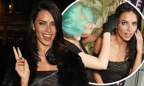 Adriana Lima gets ear pierced during LFW Week party | Daily Mail Online