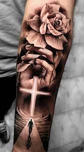 Cross with flowers tattoo forearm. Pin On Tattoos