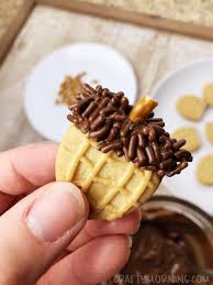 When the cookies have cooled down, use a butter knife to spread a thin layer of filling on the flat side of a cookie and then press another one on top. Nutter Butter Acorn Cookies Crafty Morning