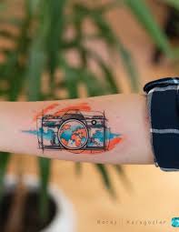 Jaw Dropping Watercolor Tattoo For Travel Lovers C Tattoo Artist Koray Karagozler Koray Karagozler Camera Tattoos Camera Tattoo Tattoos For Lovers