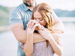 Hand Kissing Cuddly Poses Unique Romantic Poses Mauve Lace Dress Pastel Engagement Cute Couple Poses Arizona Wedding Photographer Film Wedding Photography