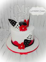 Heart wedding cake, buttercream iced heart shaped cakes, scroll designs, orange and yellow roses. Siswathi African Traditional Cake Romantic Wedding Cake African Cake African Wedding Cakes