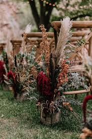 Feathery grass or also known as pampas grass is the current trend. Dark Rust And Pampas Grass Boho Wedding Aisle Decoration Colors For Wedding