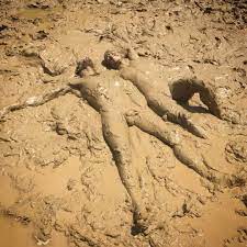 Naked mud bath day camping event