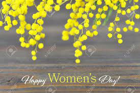15.000 women marched the streets of new york for better working conditions. Happy Women S Day Card With Mimosa Flowers On Wooden Background Stock Photo Picture And Royalty Free Image Image 96775083