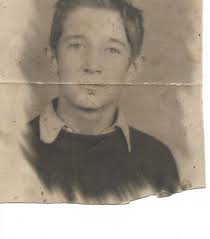 Can someone help identify this old photo of my father?