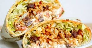 Black Beans Or Pinto Beans In Burrito Spicy Bean And Rice Burritos Recipe Vegetarian Recipes Spicy Stuffed Peppers