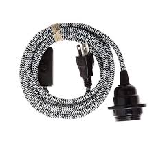 Feed the light fixture's black and white wires through the hole in the center plate. How To Make A Light Fixture Plug In For Just 7 Architectural Digest