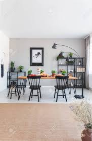 I am replacing carpet in my living room, dining room and family room. Brown Carpet And Poster In Grey Dining Room Interior With Lamp Next To Chairs And Table Real Photo Stock Photo Picture And Royalty Free Image Image 111300380