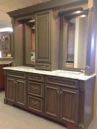 Upon lugging it home and opening the box, we find that our centered plumbing will not work with the drawers that come to the center, and the support bar that runs up the back middle of the vanity. Double Vanity With Linen Tower Middle Google Search Traditional Bathroom Vanity Grey Stained Cabinets Bathroom