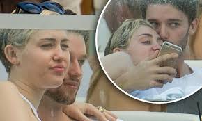Miley Cyrus continues PDAs with boyfriend Patrick Schwarzenegger at Art  Basel