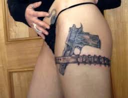 Fantastic crossed guns and roses tattoo on girl's shoulder. Gun Thigh Tattoos Designs Ideas And Meaning Tattoos For You