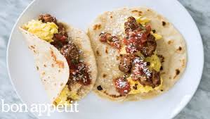Turn over and push the top edge of a metal spatula (a fish spatula works best) into the center of the tortilla, bending it into a taco shape, and press it. How To Make Egg And Sausage Breakfast Tacos Youtube