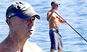 Kenny Chesney reveals physique while paddleboarding with pro surfer Laird  Hamilton | Daily Mail Online