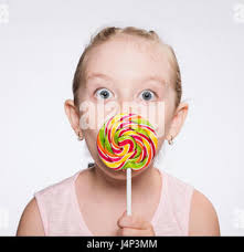 Child girl with a bright candy Stock Photo