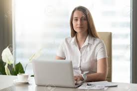 Aug 23, 2019 · you can even burn more calories while at your desk by using a standing desk, taking phone calls while standing up or walking around, or intentionally moving your trash bin away from your desk to encourage yourself to take small, frequent walking trips. Portrait Of Confident Businesswoman Sitting At Desk In Office Stock Photo Picture And Royalty Free Image Image 77767688