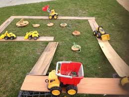 Trucks Dinosaurs And Ramps Eyfs Activities Eyfs Outdoor Area Outdoor Learning
