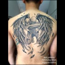 Nice contrast flying angel wings tattooed on back of a women. Elegant Regarding Meaning Fallen Angel Black And Grey Tattoo Back Back Tattoo Tattoos Black And Grey Tattoos