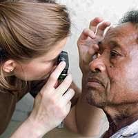 Retired Lt. Cmdr. Kathryn Barclay opens a gift from long time friend  Carolyn Long before concluding her 100th birthday celebration at the Lydia  Roper home.