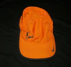 Nike Rafa Bull Logo Featherlight Mens Tennis Hat Copper Flash Black Nike Baseballcap Tennis Hat Bull Logo Mens Tennis