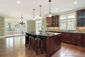 It has a neutral tone granite counter top and stainless steel appliances. Wood Floors Wood Floors With Cherry Cabinets