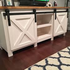 Features hooks on one side, and lots of shelving on the other. Door Barn Door Cabinet