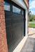 Red Brick House With Dark Garage Door