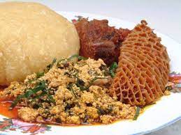 This is a very soft food served in several nigerian homes and restaurants. Nigerian Foods And Recipes Eba And Egusi Soup Efo Elegusi With Shaki Food Nigerian Food African Food