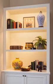 It S All About Detail In This Living Room Large Display Shelves Beautifully Showcase Bookshelves In Living Room Living Room Designs Living Room With Fireplace