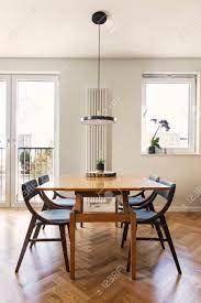 It surely challenges you to create a living room and dining room that looks efficient, comfortable and decorative. Stylish And Cozy Dining Room With Design Family Table Chairs Stock Photo Picture And Royalty Free Image Image 116987970