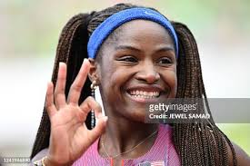 USA's Twanisha Terry smiles after competing in the women's 100m heats...  News Photo