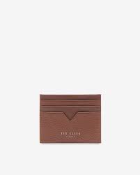 Made from 100% leather for an extra touch of luxury, it's designed with our decadence print and it has a zipped compartment for cash and coins. Leather Card Holder Tan Wallets Ted Baker Row