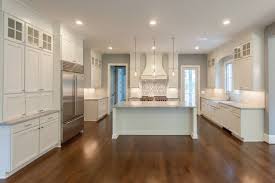 All White Transitional Kitchen With Feature Backsplash Over Range And Double Stack Kitchen Cabinet Inspiration Kitchen Bathroom Remodel Kitchen And Bath Design