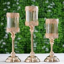 Large gold hurricane candle holders. Set Of 3 Lace Design Gold Amber Hurricane Glass Candle Holder Set With Glass Tube 13 15 17 In 2021 Candle Holders Glass Hurricane Candle Holder Crystal Candelabra Wedding