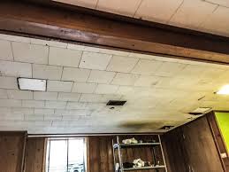 Unless you want to paint the ceiling lights, remove them and set up work lights so you can see when you are painting. Diy Painted Basement Ceiling Project First Thyme Mom