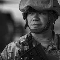 LT. COL. Eric Harris, Military Integrated Transitional Team CHIEF, 101st  Airborne Division, walks to a firing position during a live fire range. LT.  COL. Harris is wearing the Army combat uniform with