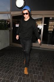 Harry styles is even more into his chelsea boots than we thought. Harry Styles Wearing Black Hoodie Black Skinny Jeans Tan Suede Chelsea Boots Blue Beanie Lookastic