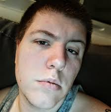 Photographer son takes pictures of high school band