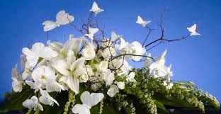 Send flowers to funeral home or church. An All White Casket Spray Of White Lilies Butterfly Orchids Casablanca Lilies And Other Flowers Manzanit Funeral Flowers Condolence Flowers Sympathy Flowers