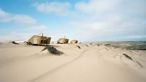 Years ago surviving sailors came ashore only to die in the pitiless wastes of the namib desert. Shipwreck Lodge S Wooden Cabins Evoke Ships Washed Up On Namibia S Skeleton Coast