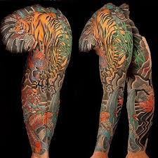 What is the best tattoo shop in michigan? Asian Japanese Full Sleeve Chest Panel Tiger Koi Lotus Tattoo By Joshua Nordstrom At Deft Tattoo Studio In Upper Michi Tattoo Studio Lotus Tattoo Sleeves Ideas
