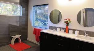 The room offers a freestanding deep soaking tub and a classy sink counter, surrounded by olive green walls. Modern Bathroom Remodel In Frederick Talon Construction