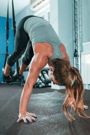 woman doing trx workout stock image