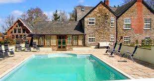 19 Places To Stay In Wales With Their Own Swimming Pool Pool Swimming Pools Natural Swimming Ponds